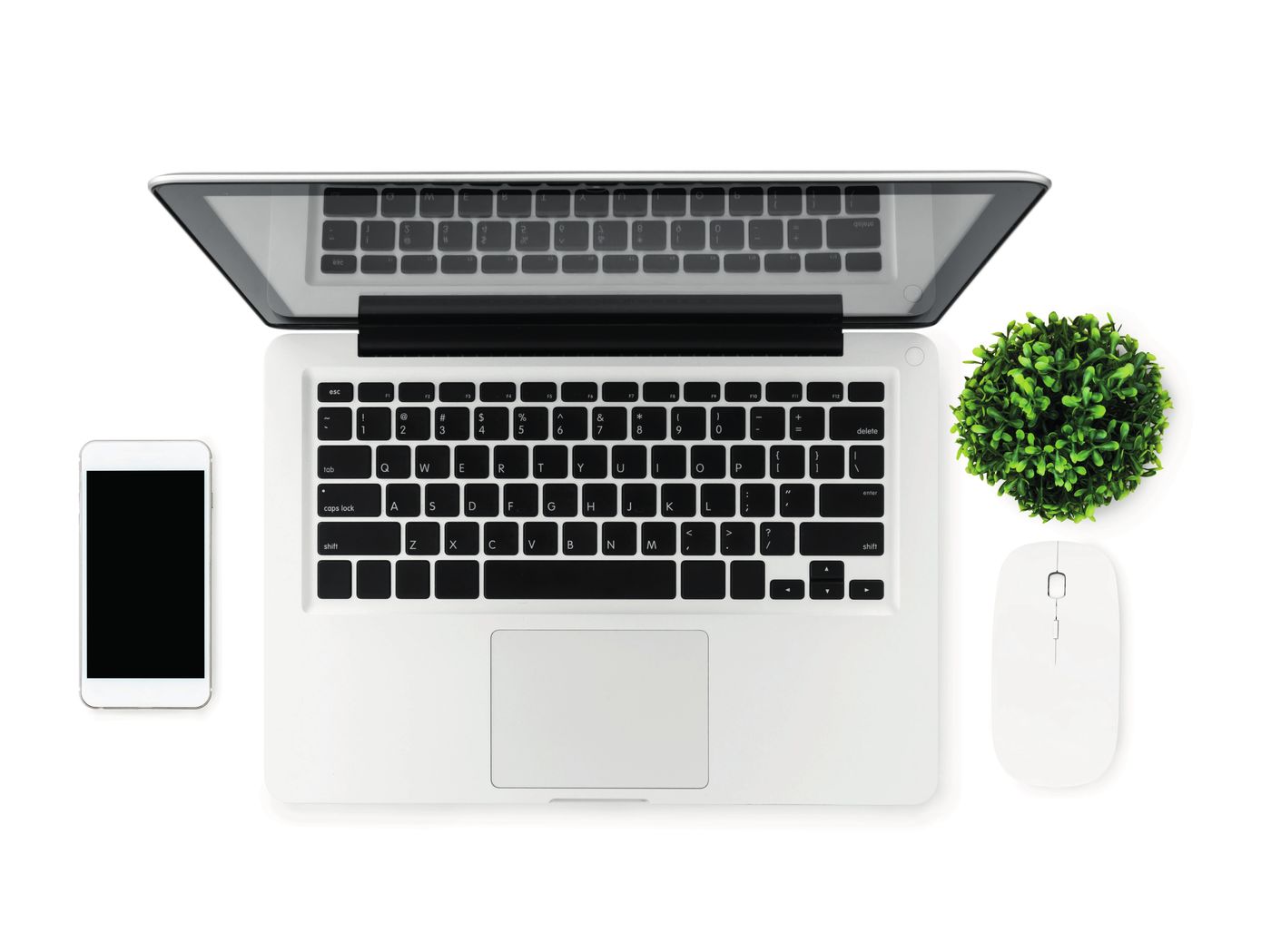 Bureau met laptop, telefoon en plantje